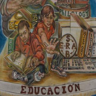 Educacion painted mural with two children. One reading, one reaching forward. Surrounded by books and computer keyboard.