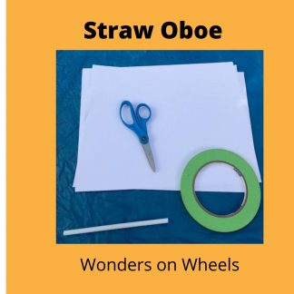 a pair of blue scissors, a roll of green tape, and a soda straw sit on top of a sheet of white paper.